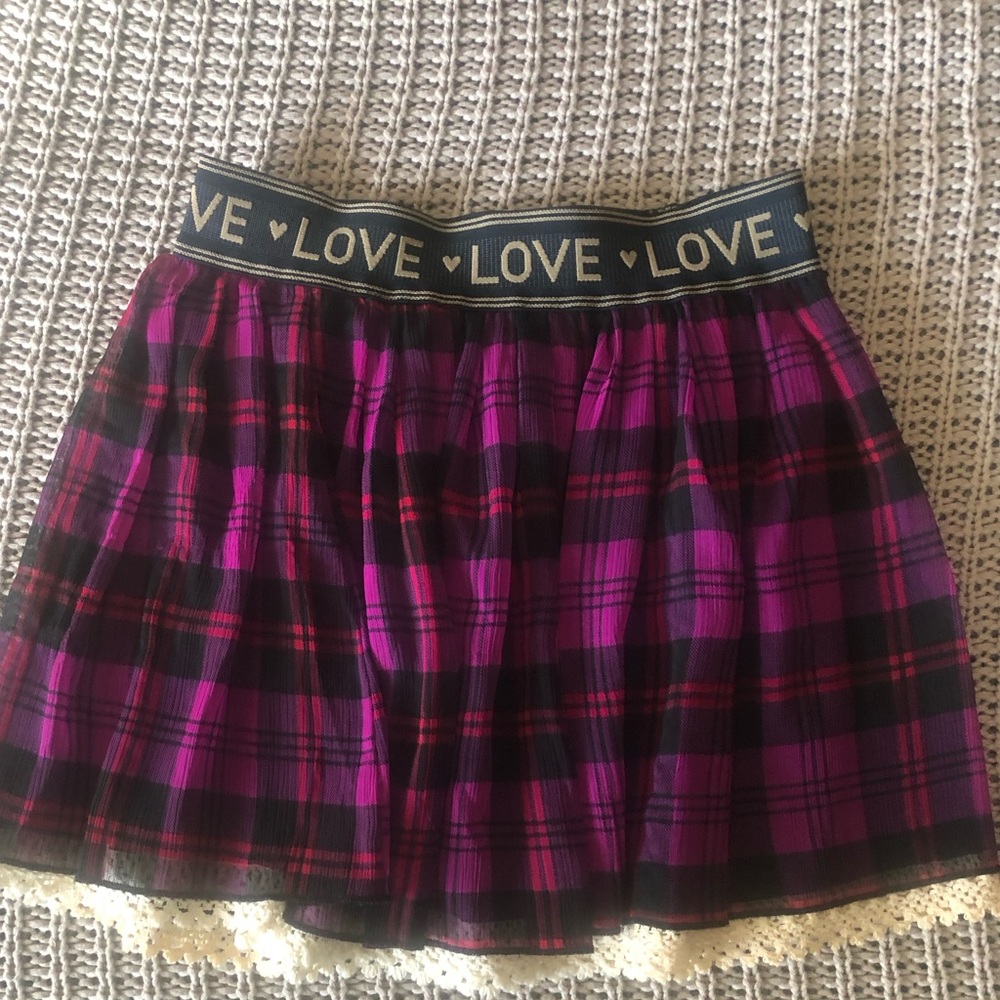 Jessica Simpson plaid skirt with lace trim.The words LOVE on waist band. Size :M